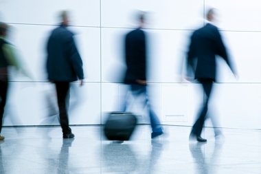 Blurred business people walking in a modern interior (Noskowski, Maciej © Noskowski, Maciej; VisaPro.ca. All Rights Reserved.)